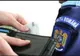 Agent de poliție brașovean prins în flagrant în timp ce lua mită 